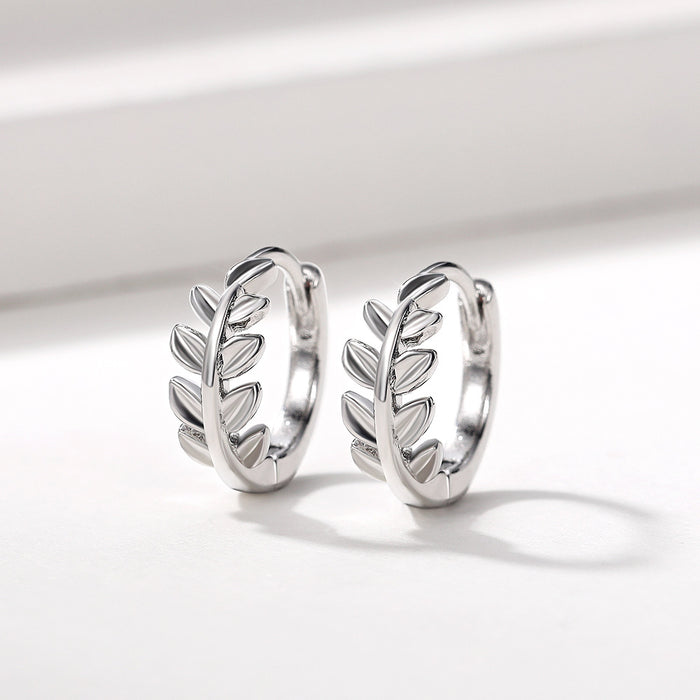 White Gold Leaf Branch Huggie Hoop Earrings Polished Metal