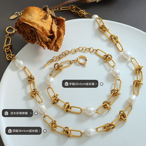 Gold knot pearl necklace and bracelet flat on plate with size labels