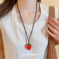 Red Strawberry Pendant Cord Necklace In Two Finishes view 1