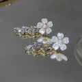 White Flower Stud Earrings with Clear Crystal Teardrops view 2