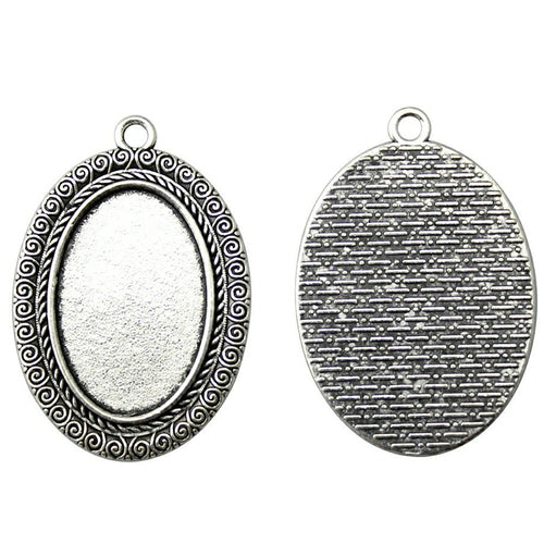 Scrollwork oval pendant setting front and back views on a white background