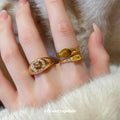 Gold Tone Asymmetrical Open Ring With Brown Oval And Yellow Crystal view 1