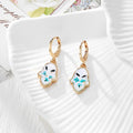 Gold Tone Pressed Flower Hamsa Huggie Earrings in Nine Options view 3