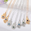Gold and Silver Tone Eyeball Hamsa Pendant Necklaces view 1