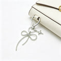 Butterfly Charm Keychains Featuring Silver Bow Across 8 Pictured Variations view 4