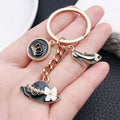 Black and White Crown Hat and Heel Metal Keychain Pair view 3