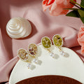 Oval Resin Cabochon Pearl Drop Earrings Gold Rose Motif view 1