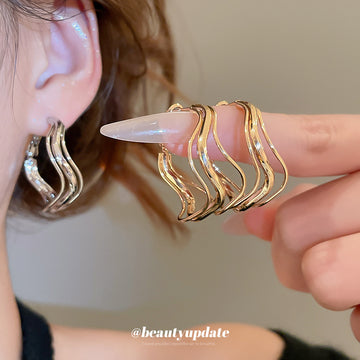 Wavy Open Hoop Earrings In Polished Gold And Silver Tones