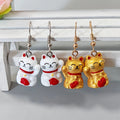 White and Gold Lucky Cat Drop Earrings with Fishhook Ear Wires view 2
