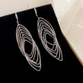 Nested Oval Wire Drop Hook Earrings In Gold And Silver view 6