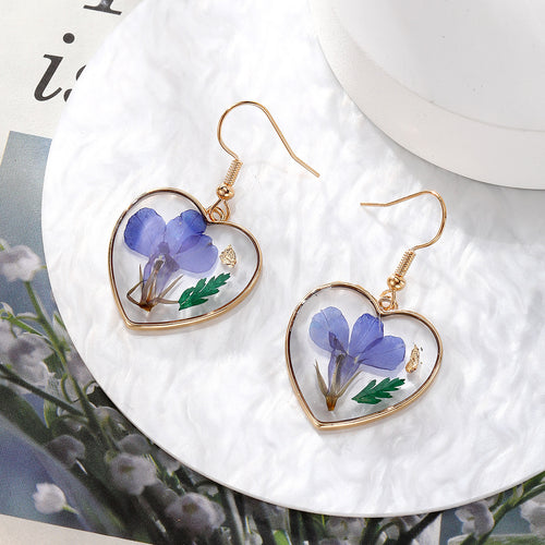 Deep purple flower heart-frame resin earrings on gold hooks