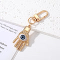 Gold and Silver Tone Geometric Hamsa and Eye Clip Keychains view 2