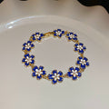 Gold Tone Blue Flower Bracelet And Unrelated Scallop Link Bracelet view 6