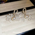 Gold Tone Bow Earrings With White Pearl And Crystal Clusters view 4