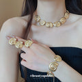 Gold Spiral Shell Necklace Bracelet Earrings and Ring view 4