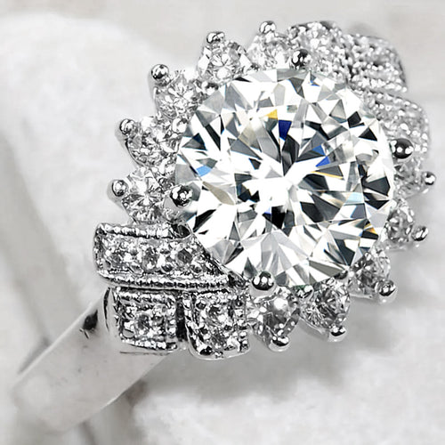 Second product view showing oversized round solitaire floral halo ring