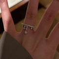 Silver Pavé Open Ring With Dangling Crystal Drop Charms view 4