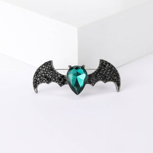 Black Crystal Bat Brooch With Faceted Green Heart Center
