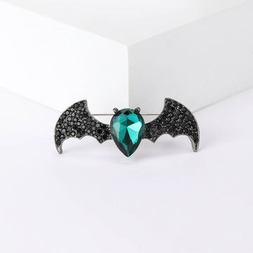 Black Crystal Bat Brooch With Faceted Green Heart Center