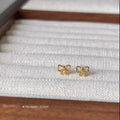 Gold Mini Outline Bow Polished Metal Stud Earrings view 1