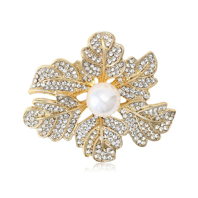 A layered crystal leaf cluster centered by a white pearl shown on a white background.