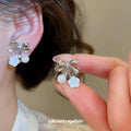 Bow Flower and Pearl Drop Ear Clips in Gold and Silver view 3