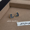 Gold Tone Heart Stud Earrings In Black And White Enamel view 1