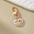 Gold Tone Small Printed Heart Evil Eye Clip Keychains in Six Designs view 2