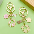Cat Charm Keychains Featuring Pink Blossom Across 19 Pictured Variations view 2