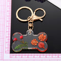 Transparent Resin Pressed Flower Dog Bone Clip Keychains in Three Colors view 4