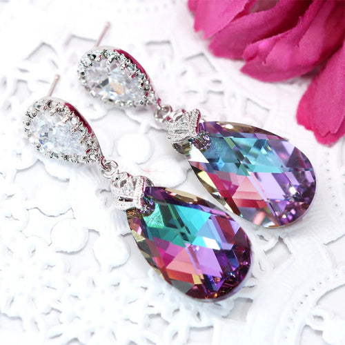 Multicolor teardrop crystal drops with clear halo tops on lace and pink flower