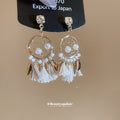 Pearl Circle White Tassel Drop Earrings with Gold Tone Details view 2