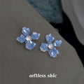 Dusty Blue Translucent Four Petal Flower Stud Earrings view 3