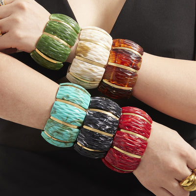On-wrist view of marbled resin stretch bracelets in main image 1.