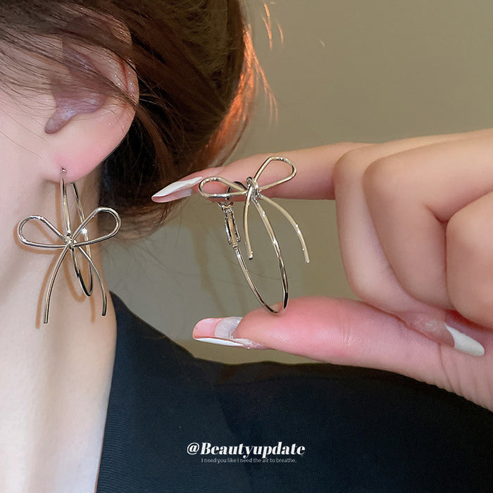 Open Bow Wire Hoop Earrings in Gold and Silver Tone