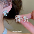 Crystal Bow Stud Earrings in Two Colors With Silver-Tone Settings view 1