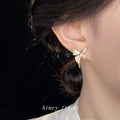 Gold Butterfly Stud Earrings White Enamel Wings CZ Accents view 2