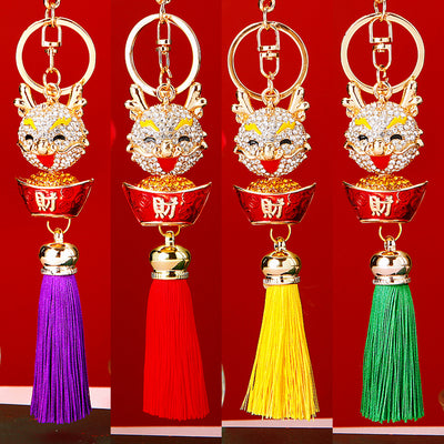 Main image 1 shows a supplied presentation of jeweled ingot dragon tassel keychains with visible attached key hardware.