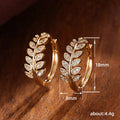 Leaf Motif Hoop Earrings In Three Polished Metal Tones view 5