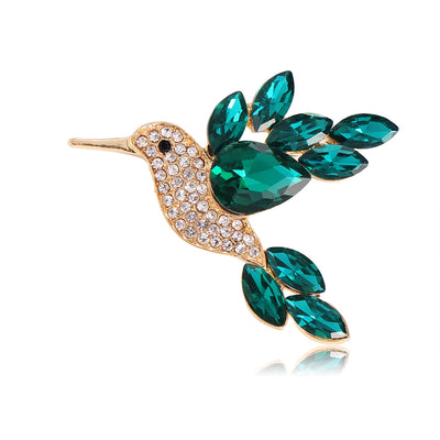 Front product view of the bird brooch pin in aqua and gold