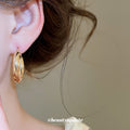 Gold Tone Smooth Interlocking Rounded Double Hoop Earrings view 2