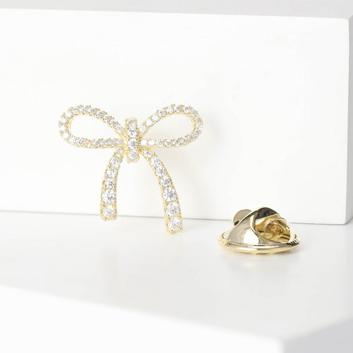 Gold mini bow brooch close front