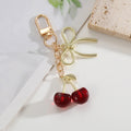 Red Cherry Charm Bag Keychain with Gold-Tone Hardware view 12
