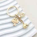 Gold-Tone Elephant Keychain With Lotus And Tree Charms view 2