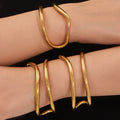Sculptural Crossing Loop Open Cuff in Gold and Silver Tone view 2