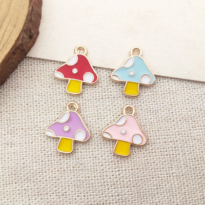 Colorful mushroom charms arranged on a light background