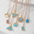 Gold Tone Blue Opal Effect Animal and Butterfly Pendant Necklaces view 1