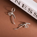 Silver Tone Ribbon Bow Long Dangle Huggie Earrings view 2
