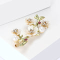 Enamel Plum Blossom Branch Brooch With Polished Metal And Sculpted Decorative Details view 3