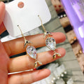 Gold Tone Fish Drop Earrings With Teardrop Stones With Polished Clear Stone Detail view 3